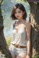 A woman leaning against a tree by the water.