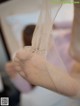 A close up of a person's foot with a veil over it.