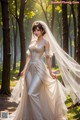 A woman in a wedding dress standing in the woods.